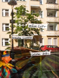 In the window of a ground floor apartment: